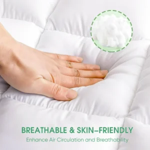 a hand pushes on a bed topper made of pure premium cotton, breathable and soft touch on the skin