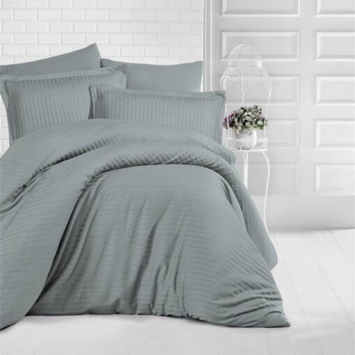 queen bed with gray stripe bed sheet and comforter on the bed adding a nice touch to the white room, stripe bed sheets and comforter set with four pillows