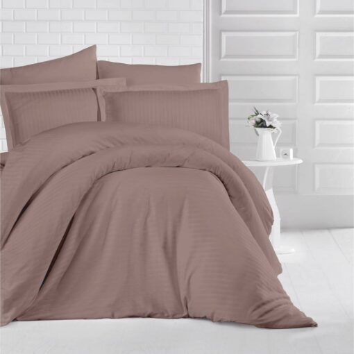 queen bed with brown stripe bed sheet and comforter on the bed adding a nice touch to the white room, stripe bed sheets and comforter set with four pillows