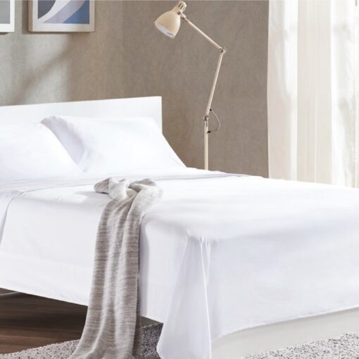 bed sheet white color spread on queen size bed, in nice decorated room, tow pillow on the bed