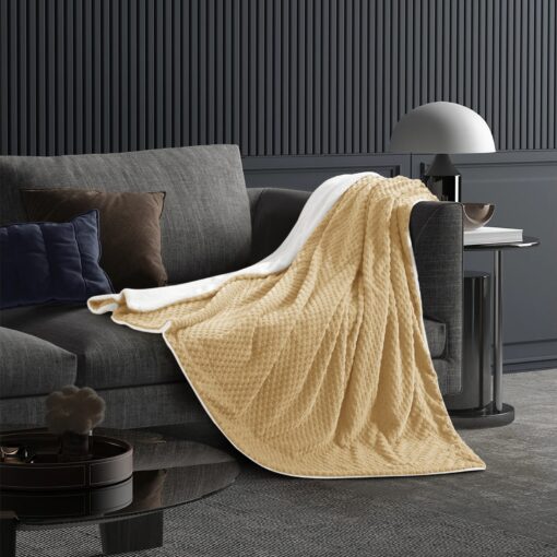 Throw Blanket Masterpiece Arwa King 200*230CM, Crafted from plush velvet, king, queen and single sizes, in beige color, spreads on gray sofa along with two cushions, adding a beautiful touch to the room decoration