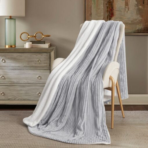 Throw Blanket Masterpiece Reem, silver color, soft touch , on a chair in a nice decorated room, Crafted from luxurious velvet, king, queen, single sizes, the Reem pattern design, combining classic elegance with contemporary flair, 200*230CM