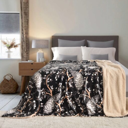 Throw Blanket Apollo Jomana King 200*230CM, queen, single sizes, black and brown colors, beautiful design of trees and peacocks pattren, made from rich velvet fabric, spreads on a queen bed with two cushions and four pillows in a nice decorated room